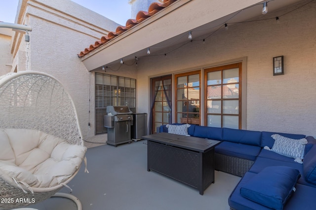 view of patio / terrace with a grill and an outdoor living space