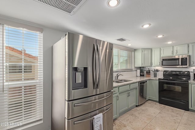 kitchen with visible vents, appliances with stainless steel finishes, a sink, and recessed lighting