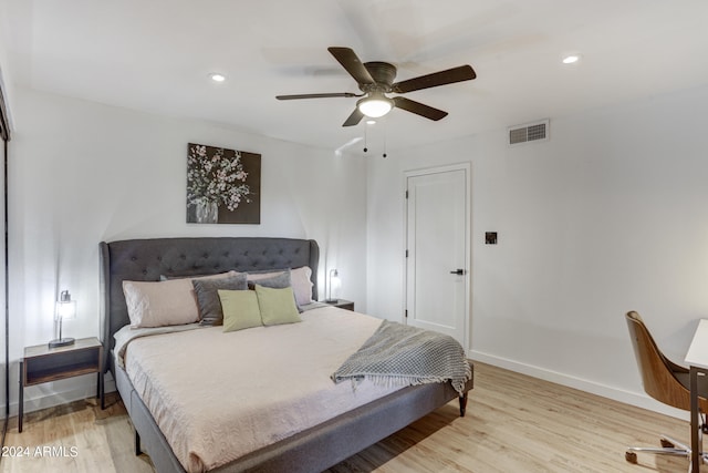 bedroom with ceiling fan and light wood-type flooring