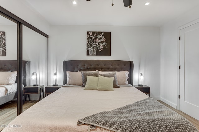 bedroom with wood-type flooring and ceiling fan