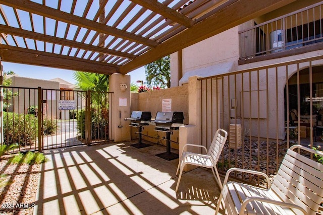 view of patio with a pergola and grilling area