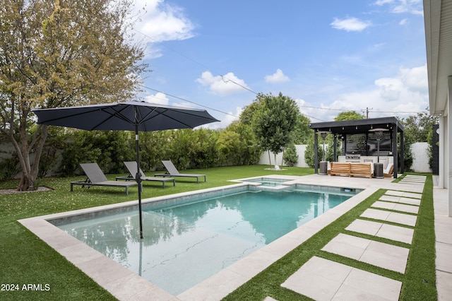 view of swimming pool featuring an in ground hot tub, outdoor lounge area, a yard, and a patio area