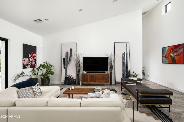 living room featuring vaulted ceiling