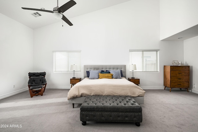 bedroom featuring ceiling fan, carpet floors, and high vaulted ceiling