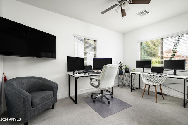 carpeted home office with ceiling fan