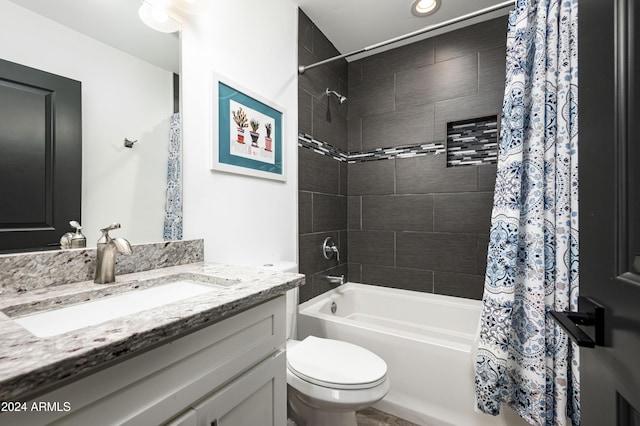 full bathroom featuring vanity, toilet, and shower / tub combo with curtain