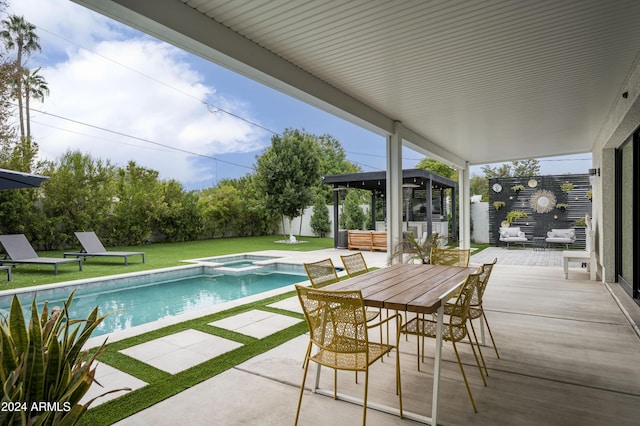 view of pool with a lawn, an outdoor living space, a patio area, an in ground hot tub, and an outbuilding