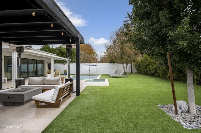 view of yard with a fenced in pool, a patio area, and a fire pit