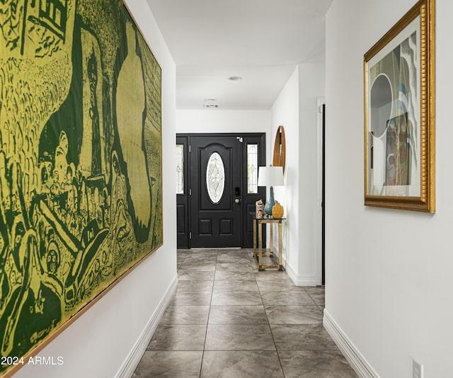 entrance foyer featuring tile patterned floors