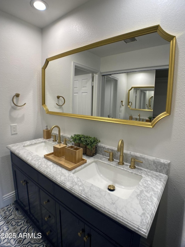 bathroom featuring tile patterned floors and vanity