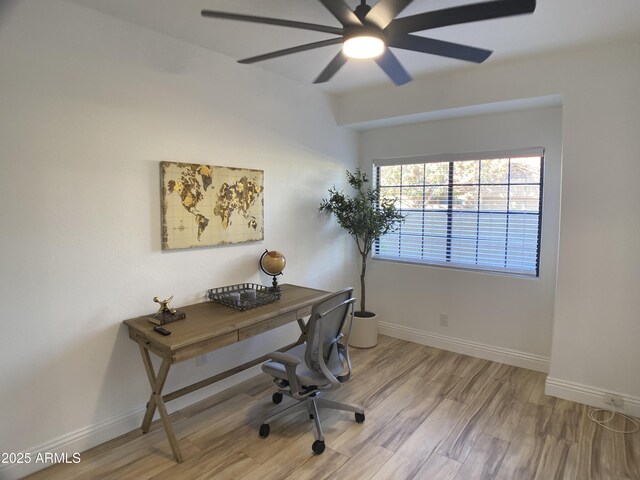 office area with ceiling fan and light hardwood / wood-style flooring