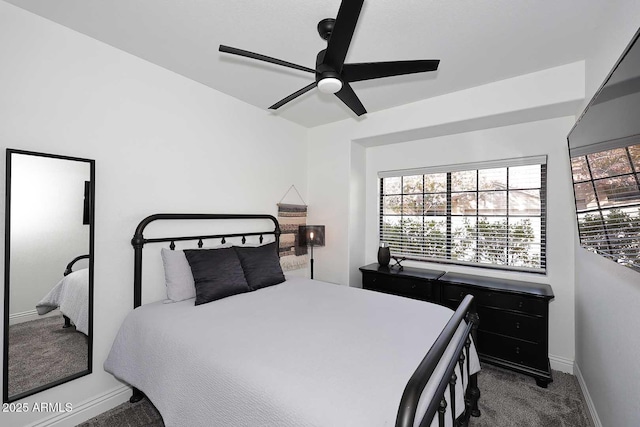 bedroom featuring ceiling fan and dark carpet