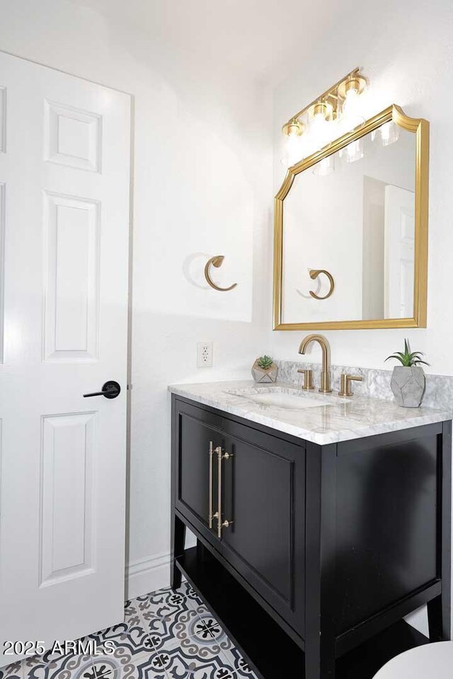 bathroom with vanity and tile patterned floors