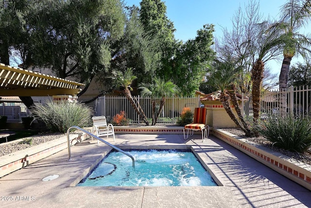 view of pool with a patio area and an in ground hot tub