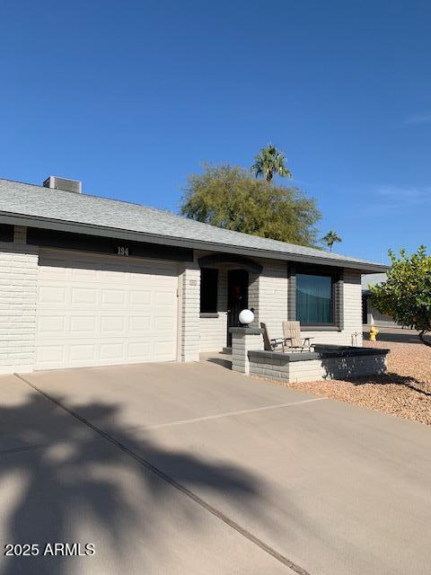 ranch-style home featuring a garage