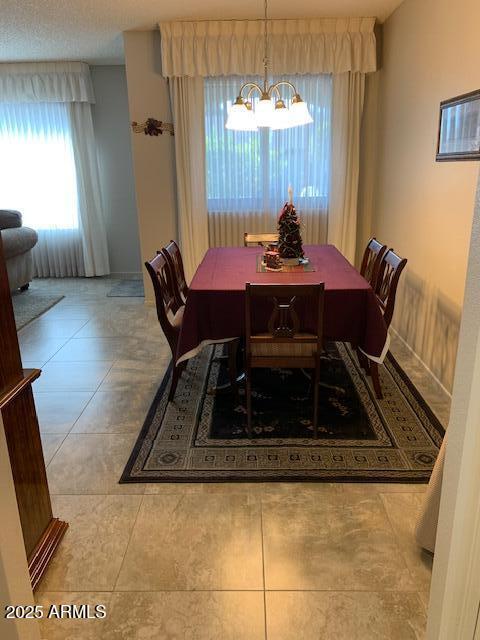 dining space featuring an inviting chandelier