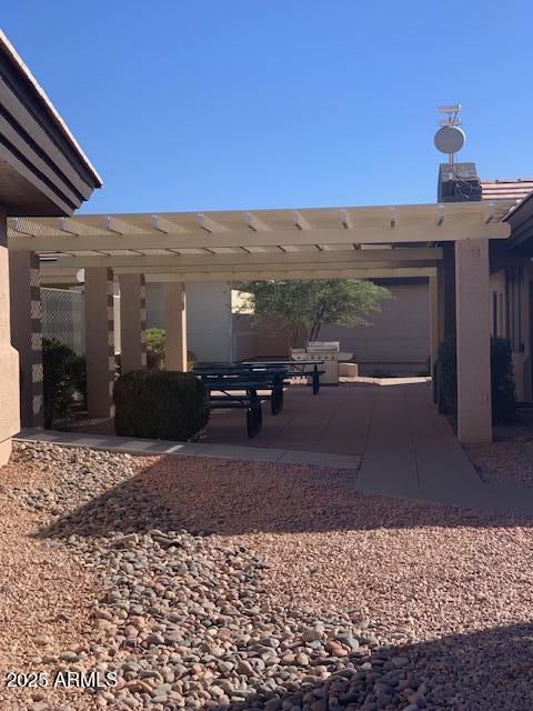 exterior space featuring a patio and a pergola