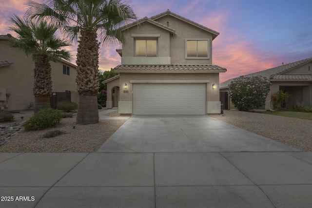 4041 W Hackamore Dr, Phoenix, AZ 85083 - view of front of house with stucco siding, an attached garage, a tile roof, and driveway