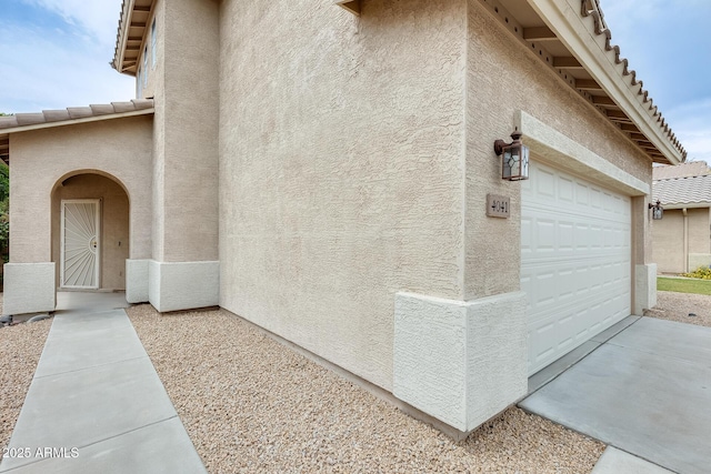 4041 W Hackamore Dr, Phoenix, AZ 85083 - view of home's exterior featuring stucco siding, driveway, a tile roof, and an attached garage