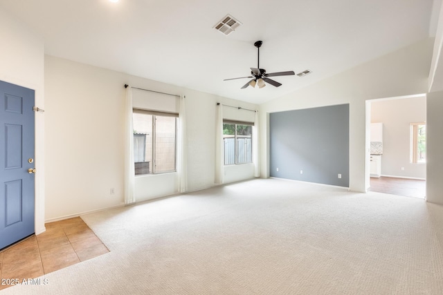 4041 W Hackamore Dr, Phoenix, AZ 85083 - unfurnished room featuring ceiling fan, carpet floors, baseboards, tile patterned flooring, and high vaulted ceiling
