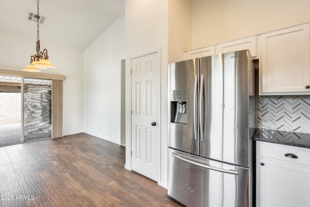 4041 W Hackamore Dr, Phoenix, AZ 85083 - kitchen with stainless steel fridge, backsplash, dark wood finished floors, white cabinets, and high vaulted ceiling