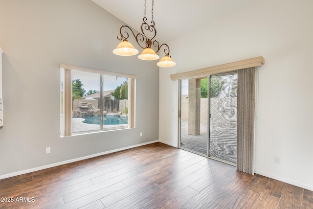 4041 W Hackamore Dr, Phoenix, AZ 85083 - empty room featuring high vaulted ceiling, wood finished floors, baseboards, and a chandelier