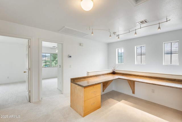 4041 W Hackamore Dr, Phoenix, AZ 85083 - unfurnished office featuring light colored carpet, built in desk, plenty of natural light, and baseboards