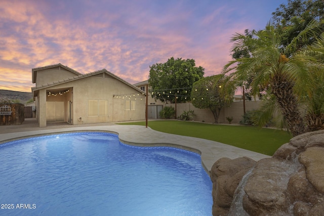 4041 W Hackamore Dr, Phoenix, AZ 85083 - pool at dusk featuring a fenced backyard and a patio area