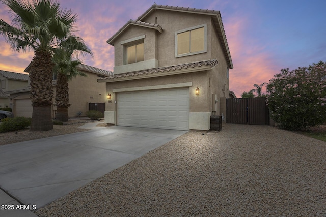 4041 W Hackamore Dr, Phoenix, AZ 85083 - view of front of house with stucco siding, concrete driveway, a gate, a garage, and a tiled roof