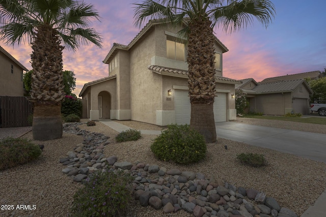 4041 W Hackamore Dr, Phoenix, AZ 85083 - view of front facade featuring stucco siding, concrete driveway, an attached garage, and a tiled roof