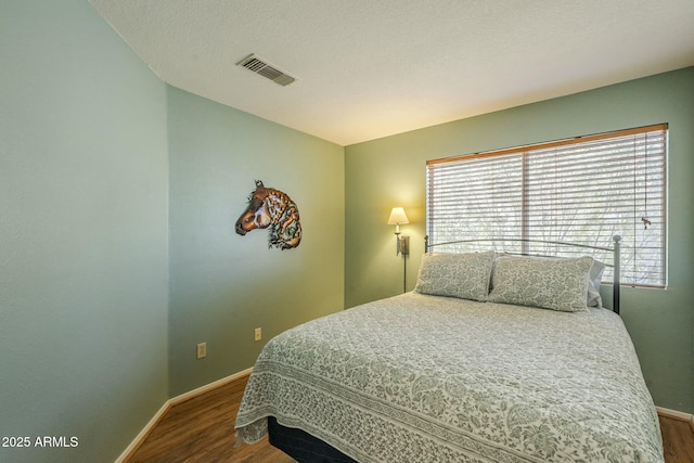 bedroom featuring hardwood / wood-style floors