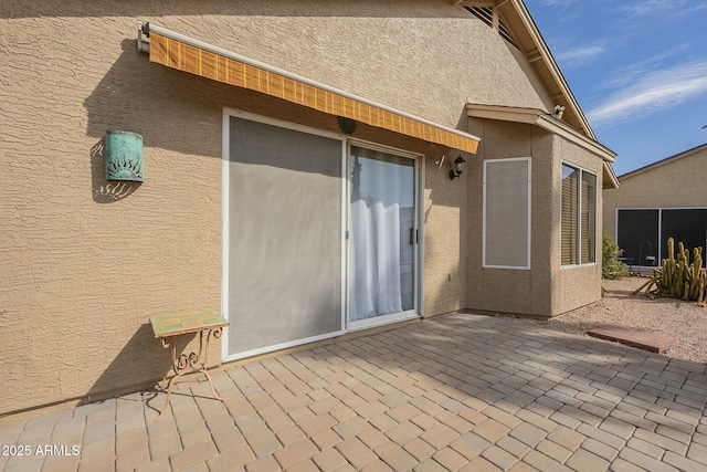 rear view of property featuring a patio area