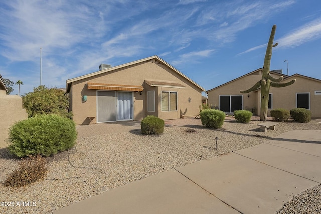 rear view of property with central AC unit