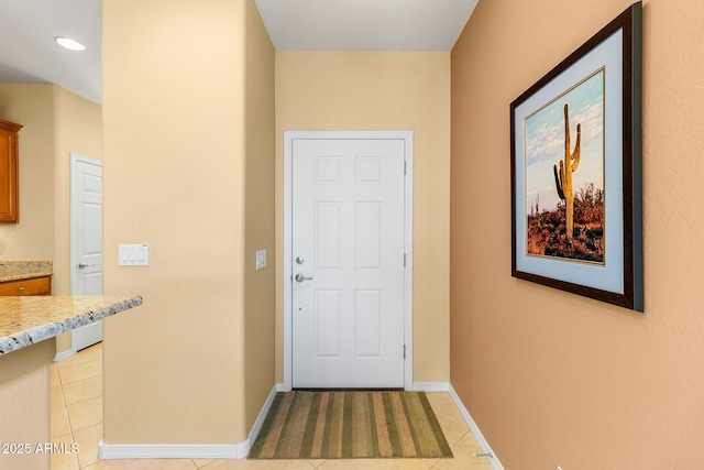 doorway to outside featuring light tile patterned flooring