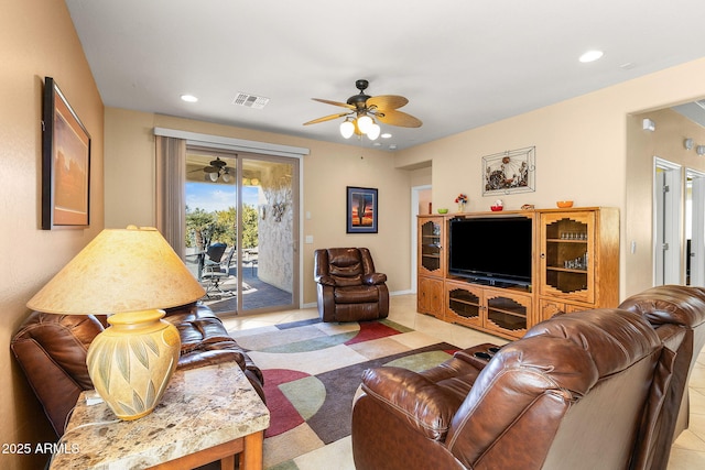 tiled living room with ceiling fan