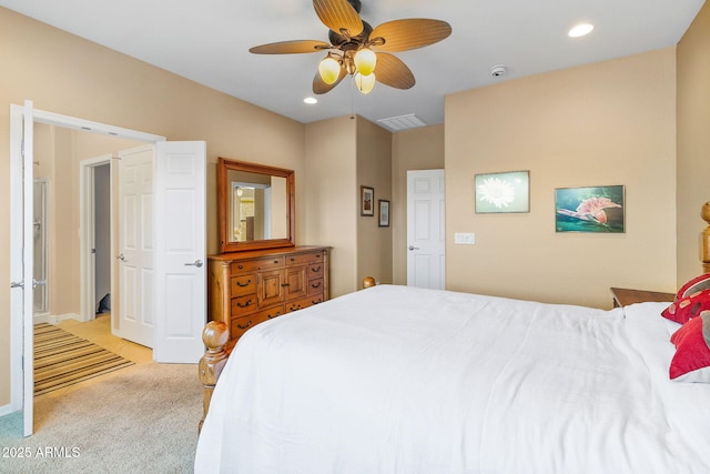 bedroom featuring ceiling fan and light carpet