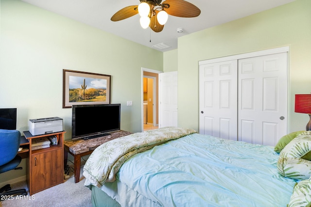 carpeted bedroom with a closet and ceiling fan