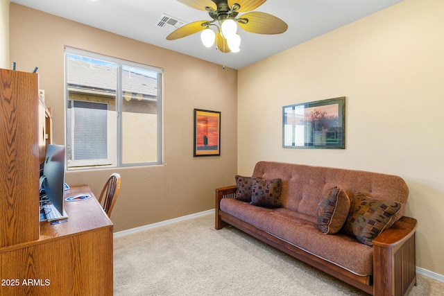 office area featuring ceiling fan and light carpet