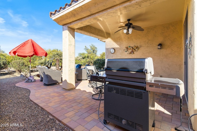 view of patio featuring ceiling fan and area for grilling