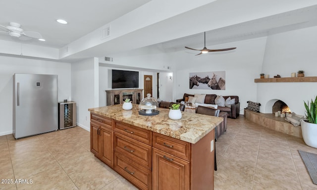 12682 N 80th Pl, Scottsdale, AZ 85260 - kitchen with ceiling fan, freestanding refrigerator, light stone countertops, wine cooler, and recessed lighting