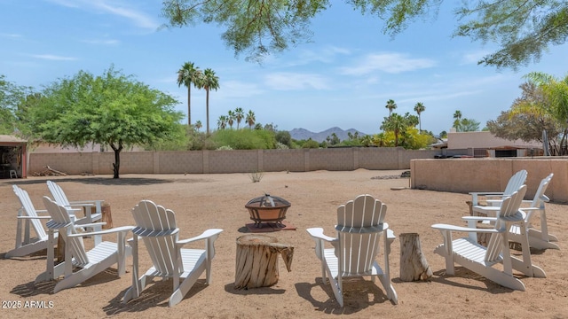12682 N 80th Pl, Scottsdale, AZ 85260 - fenced backyard featuring an outdoor fire pit and a mountain view