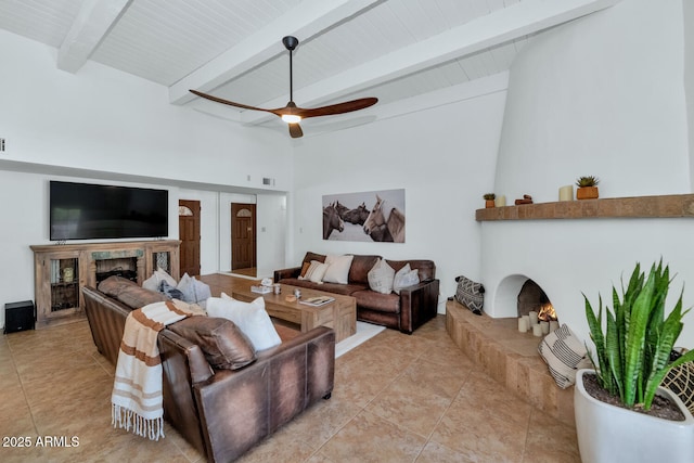 12682 N 80th Pl, Scottsdale, AZ 85260 - living room featuring a warm lit fireplace, light tile patterned floors, and a ceiling fan