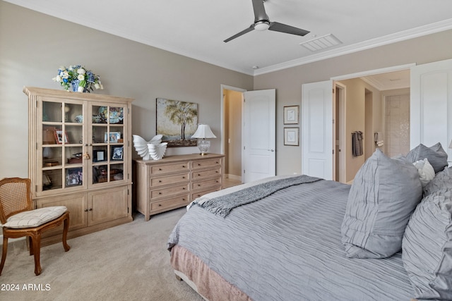 bedroom with ceiling fan, crown molding, and light carpet