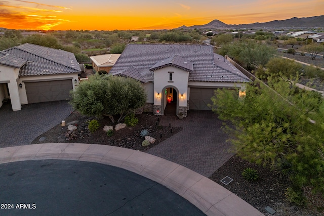 view of front of house featuring a mountain view and a garage