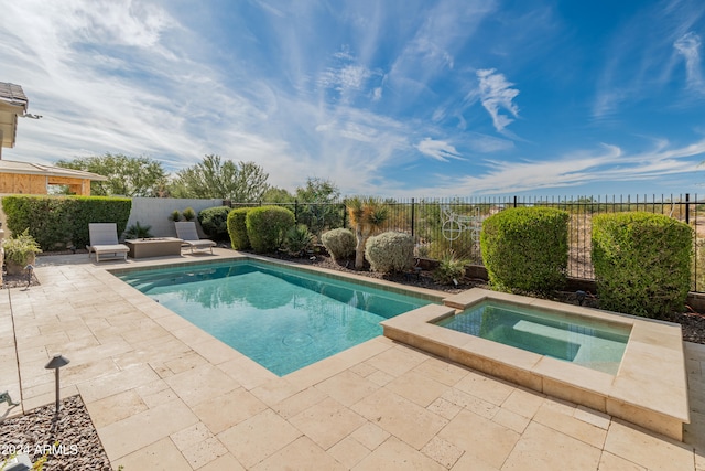 view of pool featuring an in ground hot tub and a patio