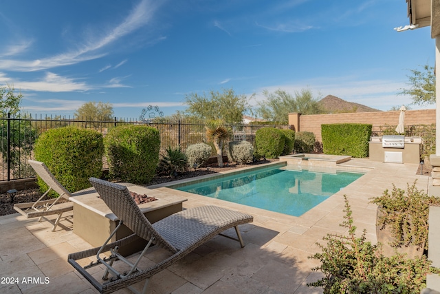 view of swimming pool featuring a mountain view and a patio area