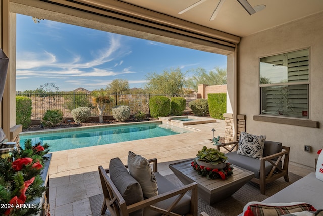 view of swimming pool with an in ground hot tub, a patio, and ceiling fan