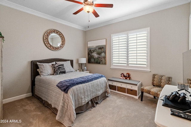 bedroom featuring ceiling fan, light carpet, and ornamental molding