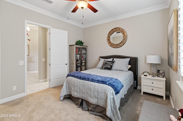 bedroom featuring ceiling fan, light colored carpet, and ornamental molding