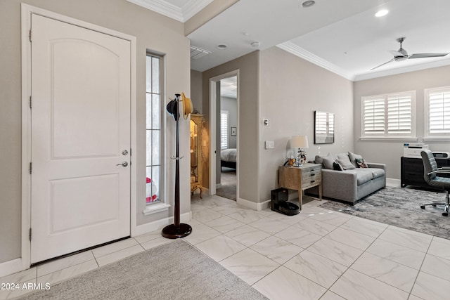 foyer featuring crown molding and ceiling fan